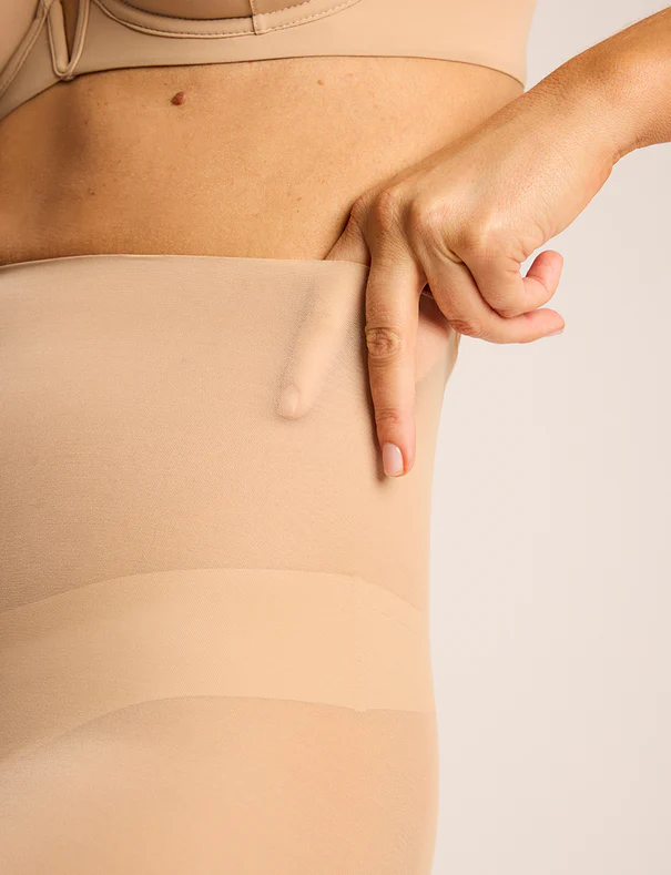 Close-up of the Commando Featherlight Control Short in Beige showing the lightweight stretch mesh and smoothing fit